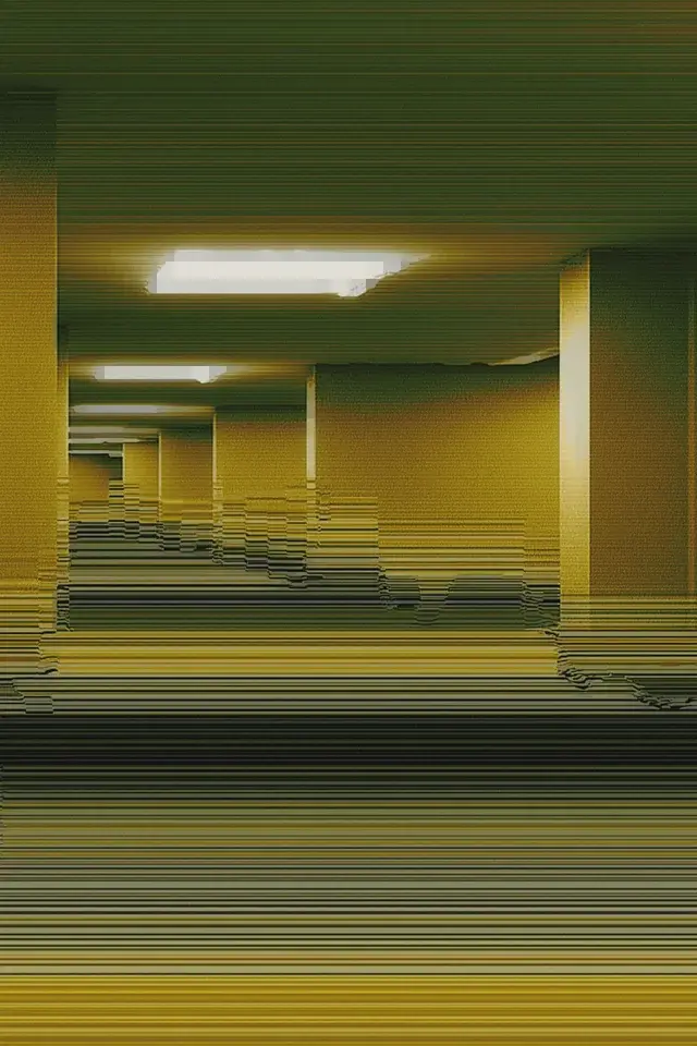 A hallway with a yellow wall and a light on the ceiling.