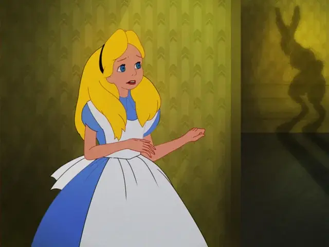 A girl in a blue dress with blonde hair and blue eyes.