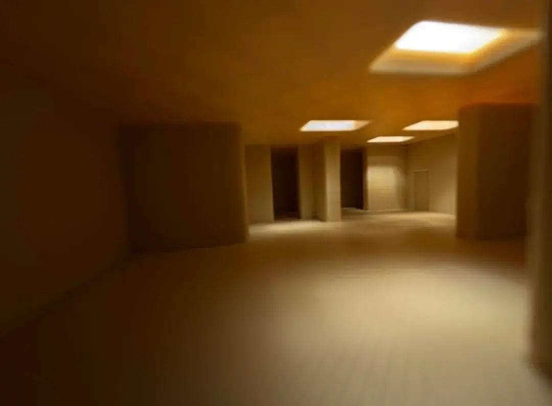 A hallway with a doorway and a window.