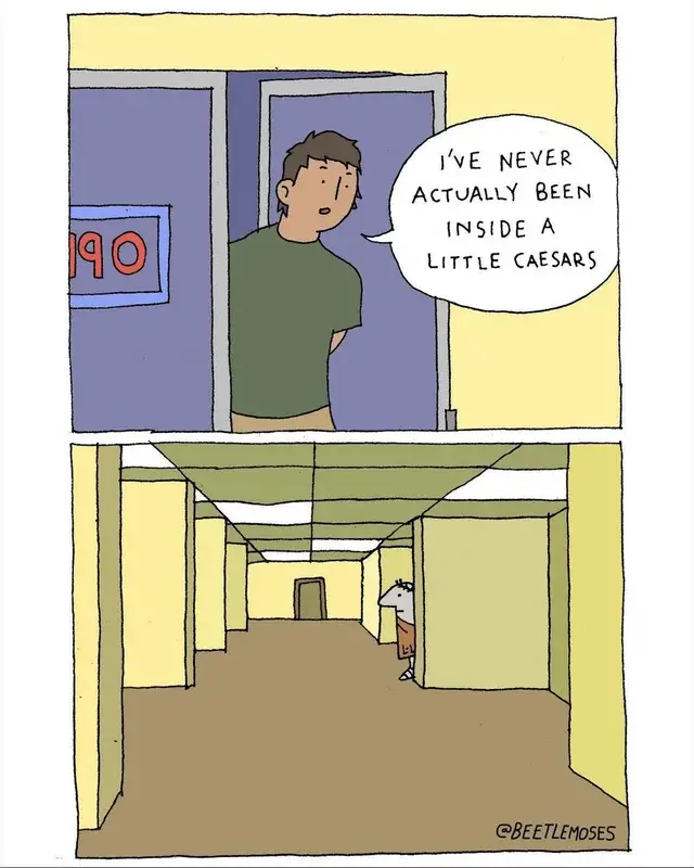 A man standing in a hallway with a sign that says 900.